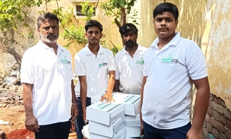Qurbani Easy team members with boxes of packed Qurbani meat