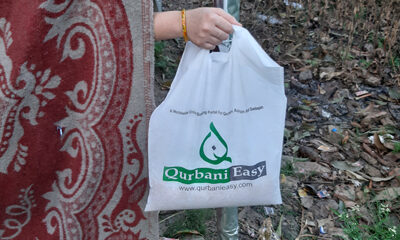 The bag bears the Qurbani Easy branding, along with the slogan, "Your Qurbani/Sadaqah Contribution at the Door of a Needy," emphasizing the organization's commitment to efficient and impactful charitable services.
