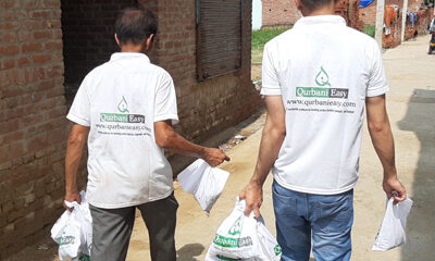 The setting—an urban locality—illustrates their grassroots efforts in connecting donors with those in need, embodying the values of charity and compassion central to Qurbani.