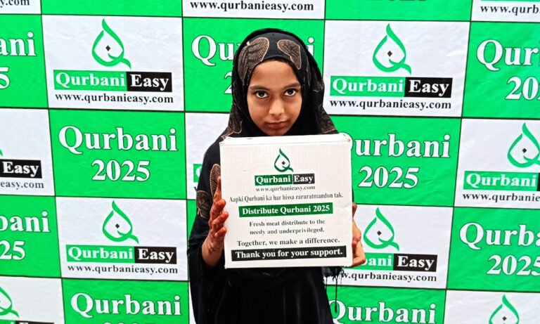 A girl holding a box of Qurbani meat distributed by Qurbani Easy in 2025