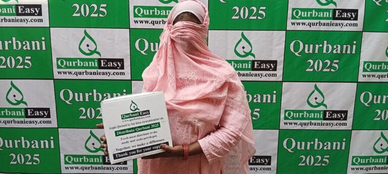 A woman receiving a box of Qurbani meat from Qurbani Easy, 2025